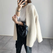La brillantezza del cashmere | Elegante cardigan in pelle scamosciata